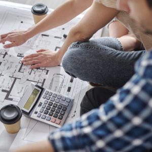 Close up of couple calculating costs of new house Close up of couple calculating costs of new house